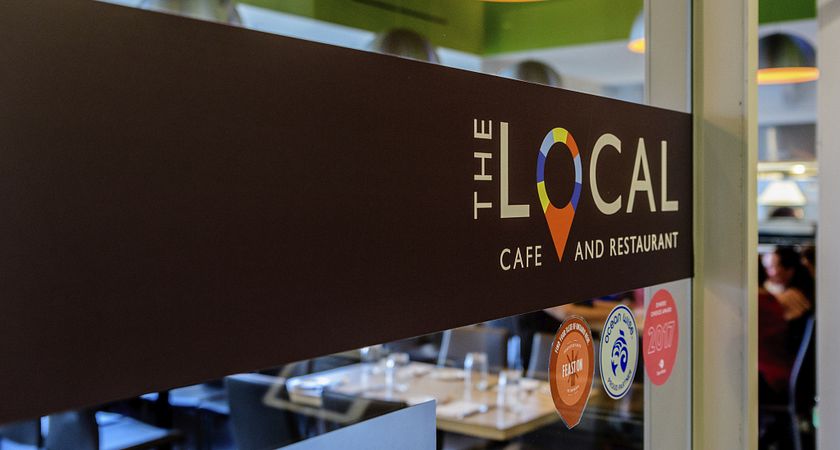 close up photograph of the local cafe and restaurant sign