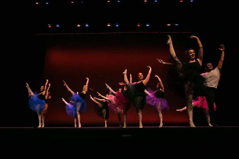 A group of ballerinas perforing on stage