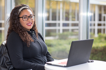 student working at a laptop
