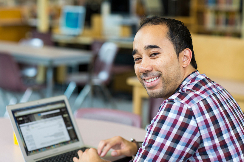 Male student working on a computer