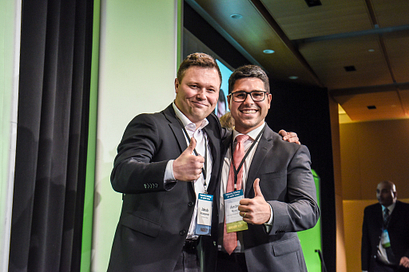 centennial college faculty member posing with a student after their receive a scholarship