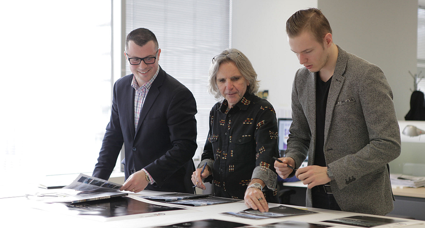 Picture of student showing work to industry professionals