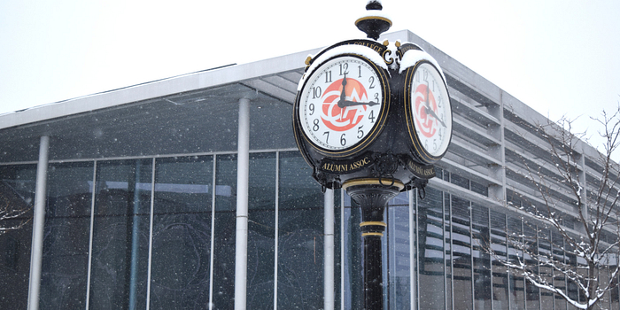 Picture of the Centennial College Alumni Association clock in the Progress Campus courtyard covered with snow in the winter