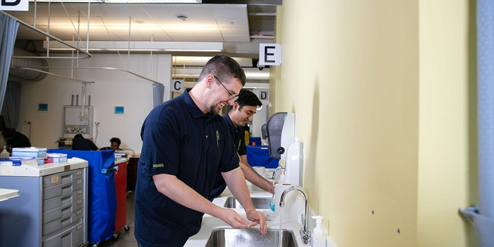 Students washing their hands