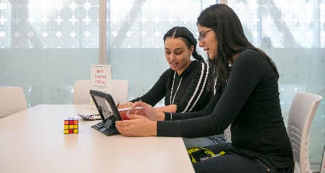 Student and math tutor in a math drop-in session at Ashtonbee campus.