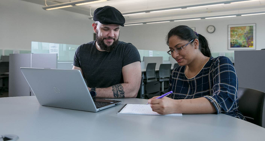 students with laptop computer