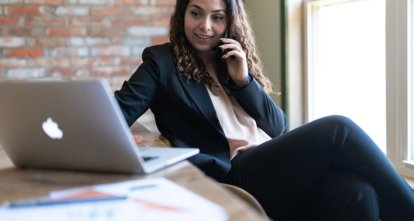 A female student on her laptop video chatting in a Centennial Meetups Academic group