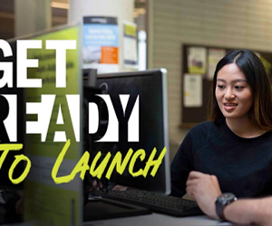 Image of two students at a computer in the library with text Get Ready to Launch