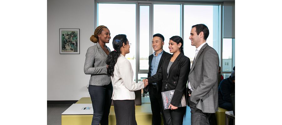 A group of Centennial College students networking