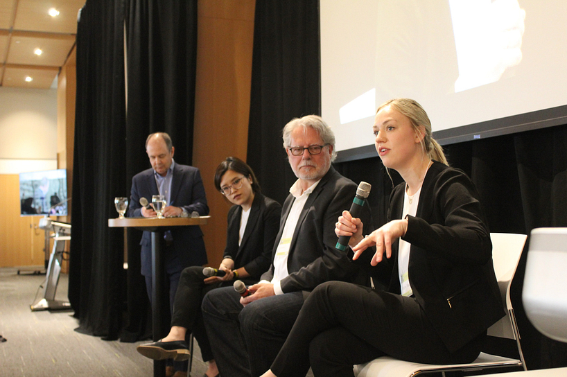 Panelists speaking to an audience during RISES 2019