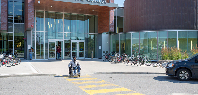 Exterior shot of students in front of the Progress Campus Library building