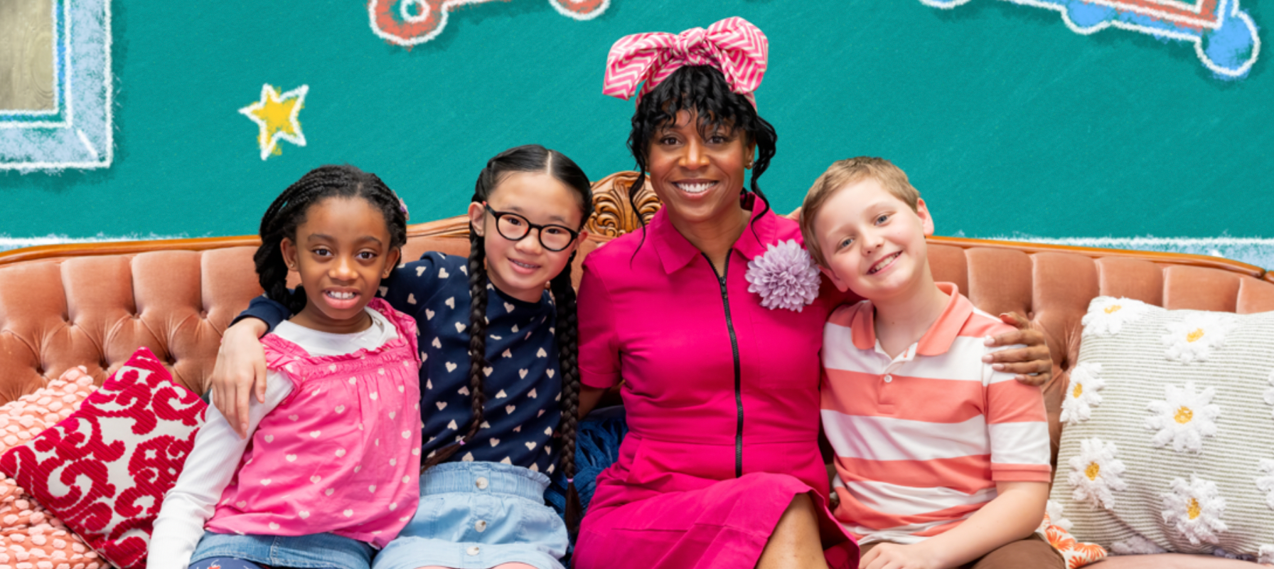 Khalilah Brooks and a cast of three kids sitting on a sofa from a scene from Aunty B's House on CBC