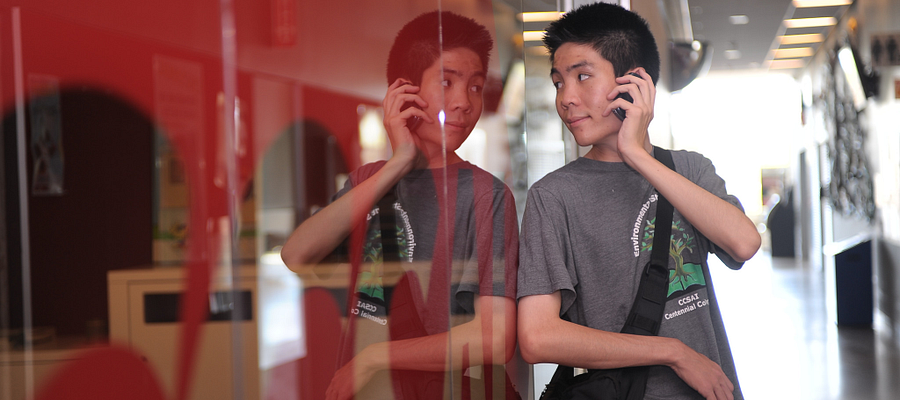 A student leaning against CCSAI office