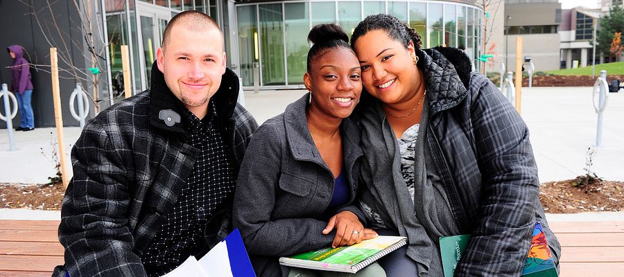 Picture of Centennial College students sitting outside the Progress Campus Library
