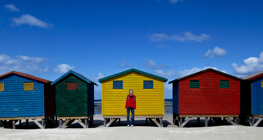 International Student on a GCELE Trip standing in front of colourful houses
