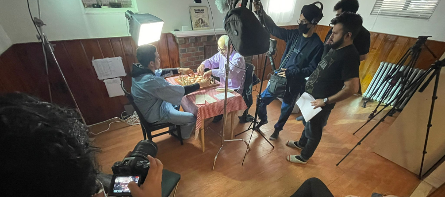 A picture of students performing video shooting for Check on a Mate