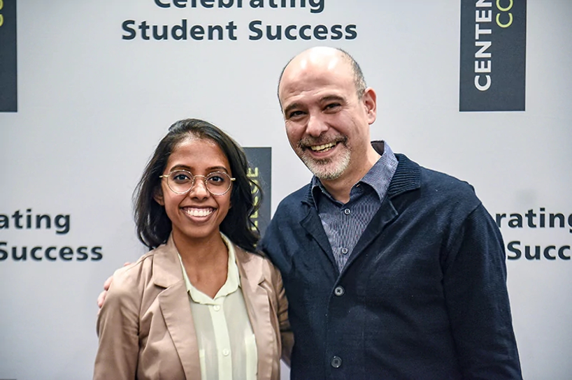centennial college student and staff member smiling at a student success event