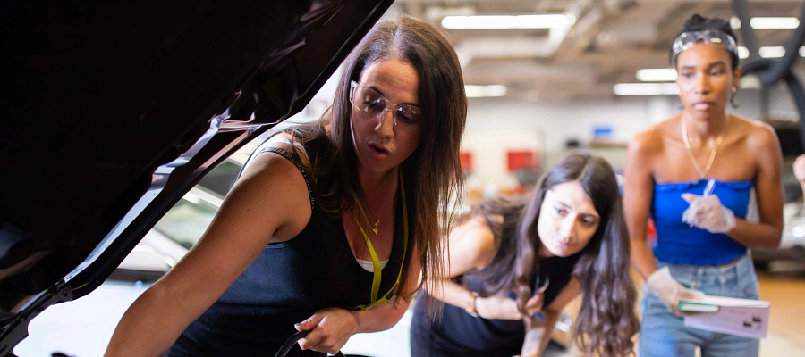 Girls mechanical team working in an automotive lab