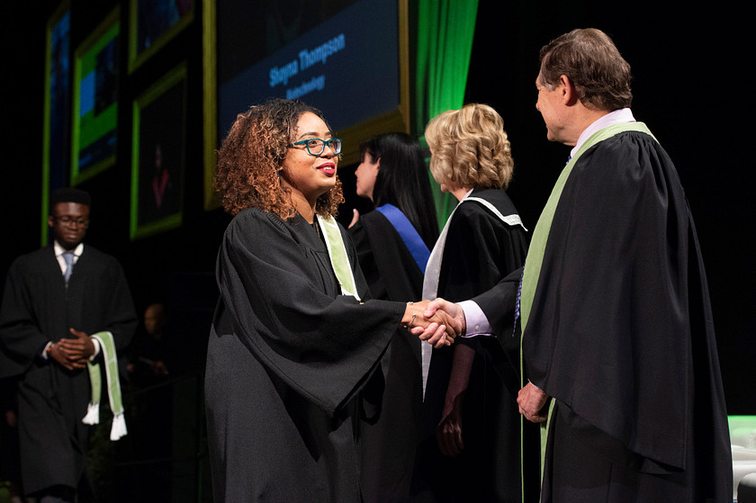 Students accepting their convocation award during their graduation ceremony at Centennial College