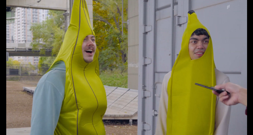 two people dressed in banana suits