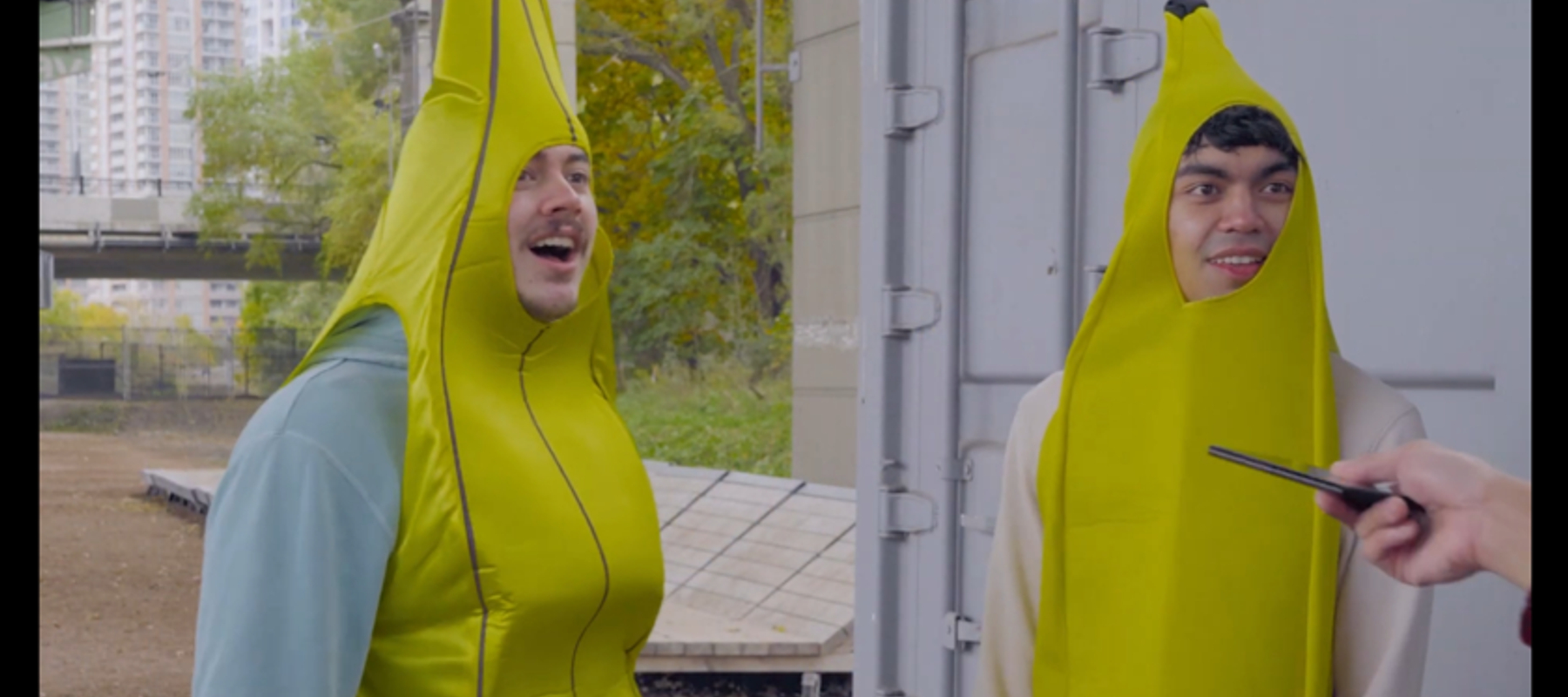 two people dressed in banana suits