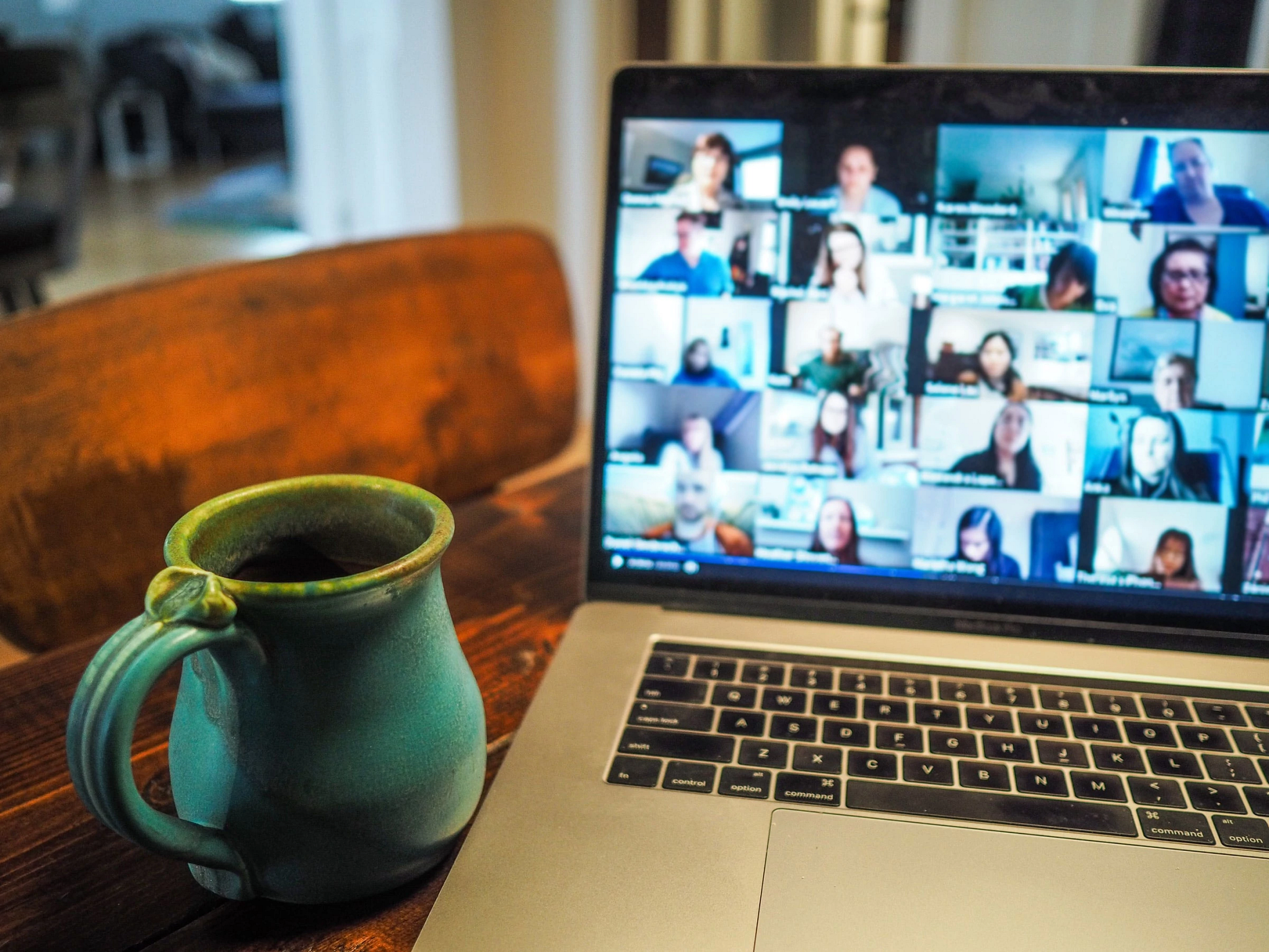 a coffee cup and laptop displaying an online course