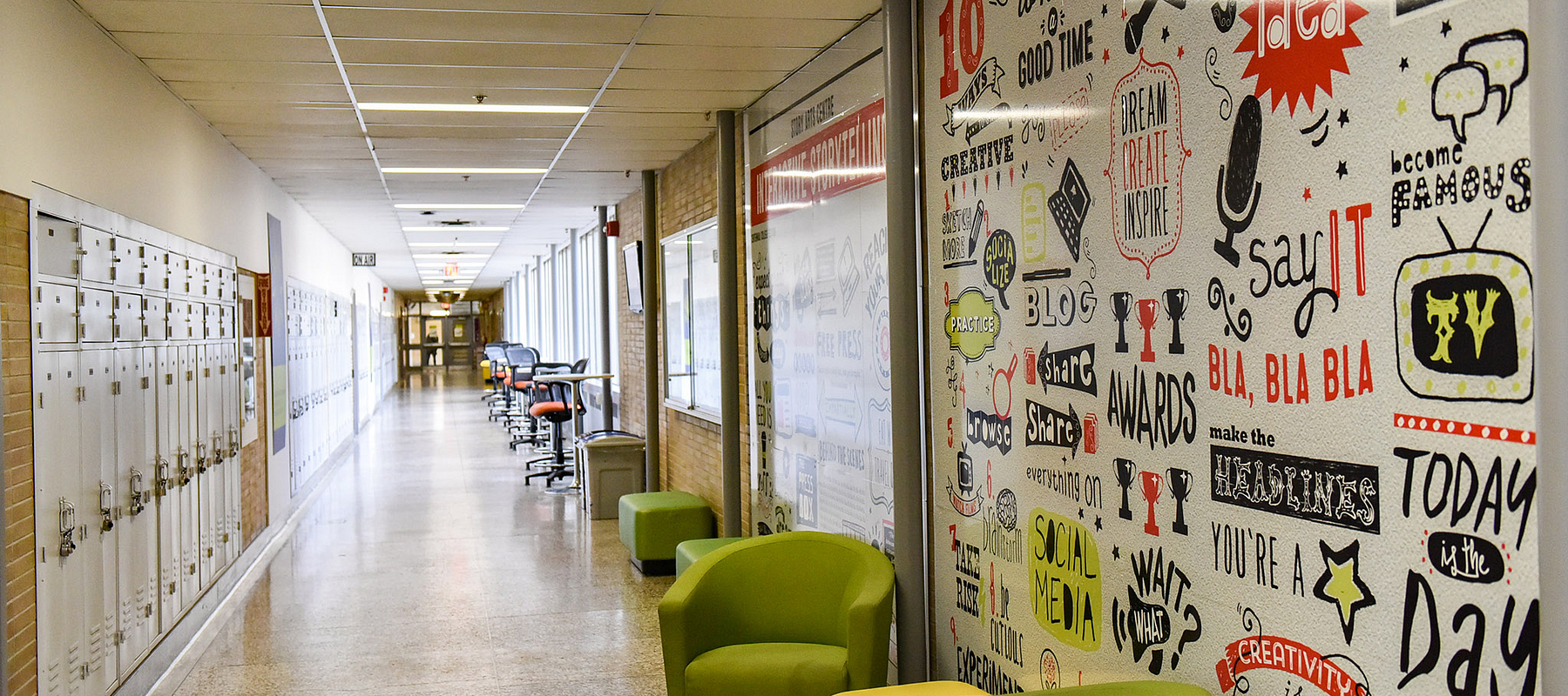 story arts centre hallway empty with centennial college green lounge chairs