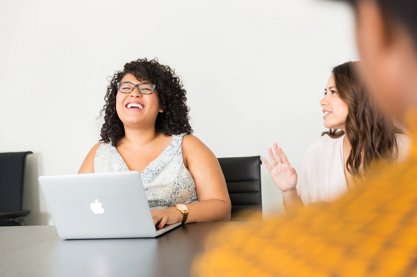 Two female from PR program smiling