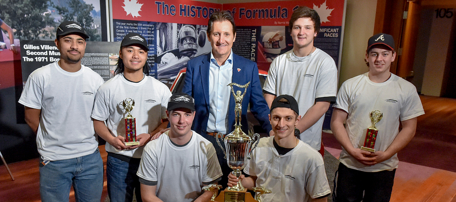 Picture of high school students holding their 2017 Canadian International AutoShow trophy