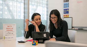 student and tutor in the math drop-in centre