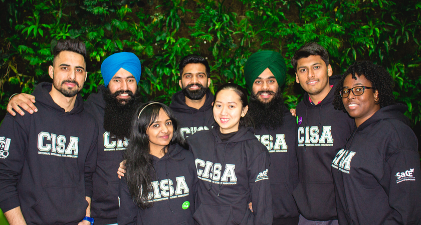 A group of Centennial International Student Ambassadors while wearing CISA shirts