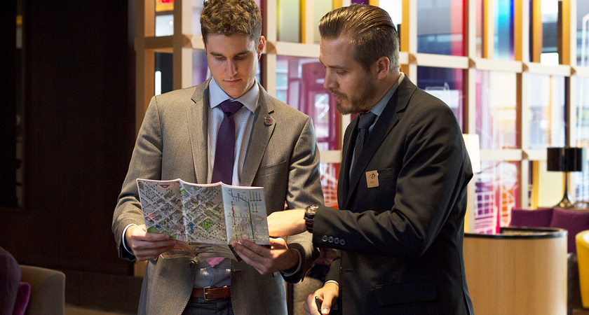 two people looking at a map