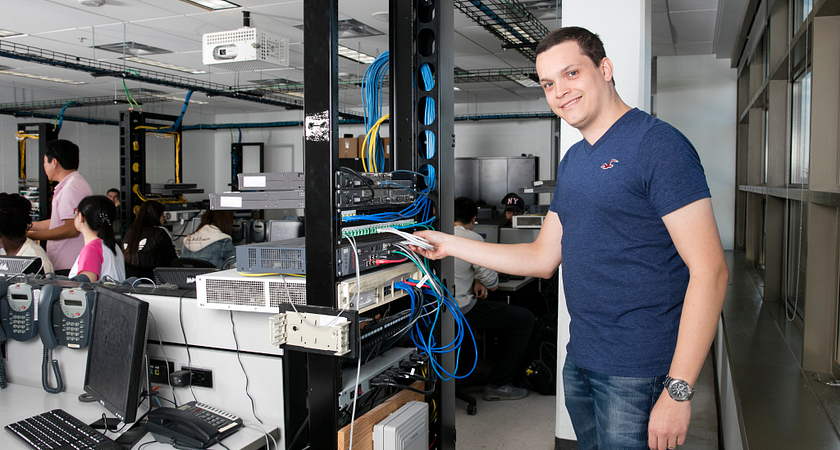 picture of a Centennial College part-time networking program student working in a computer lab