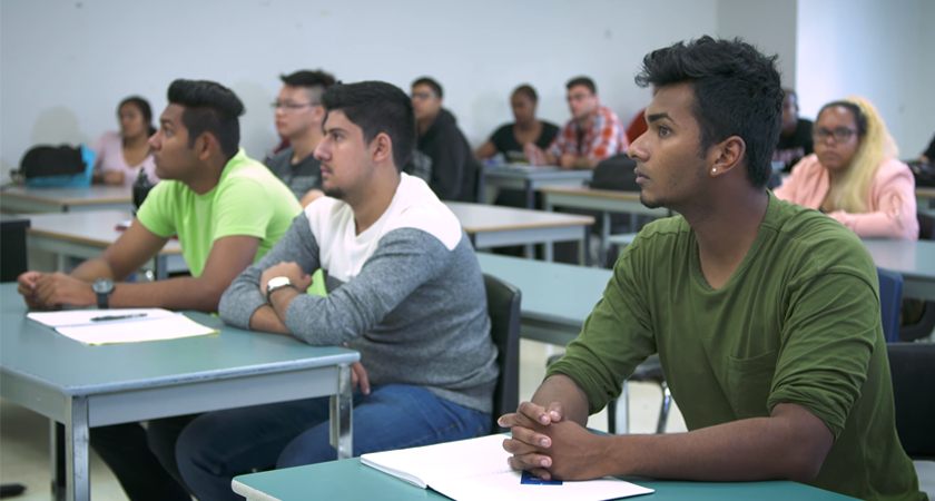 Attentive students sitting in a classroom