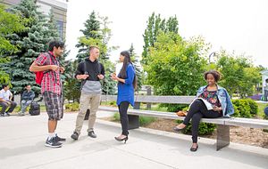 picture of Centennial College students talking to one another outside Progress Campus